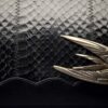The Swift Clutch by Emerald Faerie. Recycled vintage handbags with solid bronze motif.