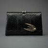 The Swift Clutch by Emerald Faerie. Recycled vintage handbags with solid bronze motif.