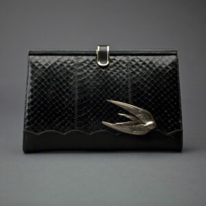 The Swift Clutch by Emerald Faerie. Recycled vintage handbags with solid bronze motif.