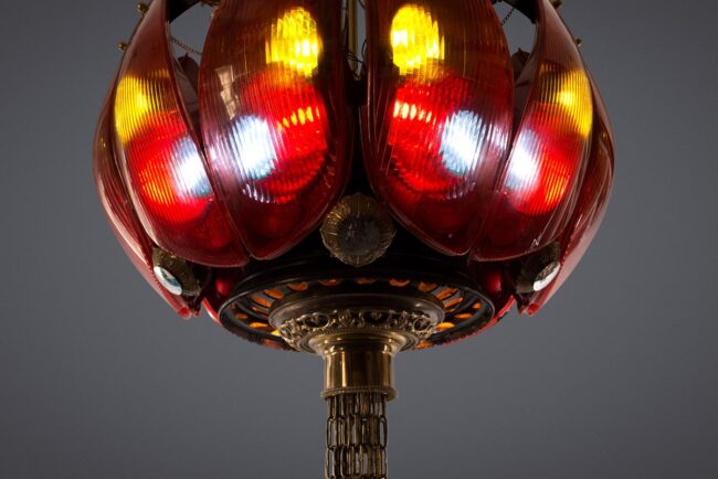 scrapyard chandelier made from Peugeot 306 break lights and various scrap car parts.